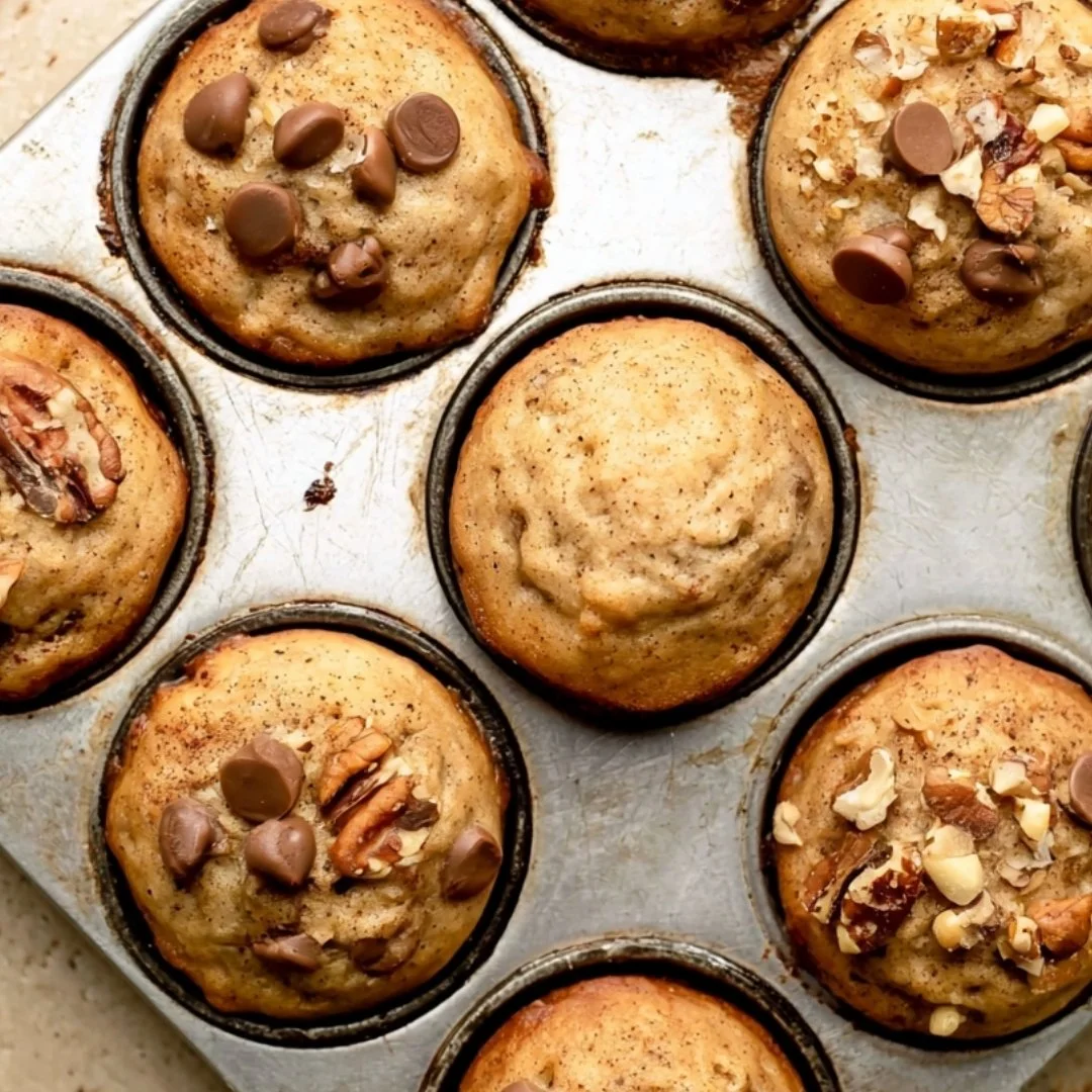 Cozy mini banana muffins fresh out of the oven, golden and fluffy.