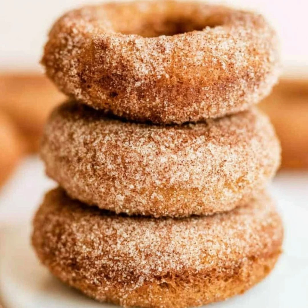 Delicious homemade pumpkin spice donuts with a sprinkle of cinnamon