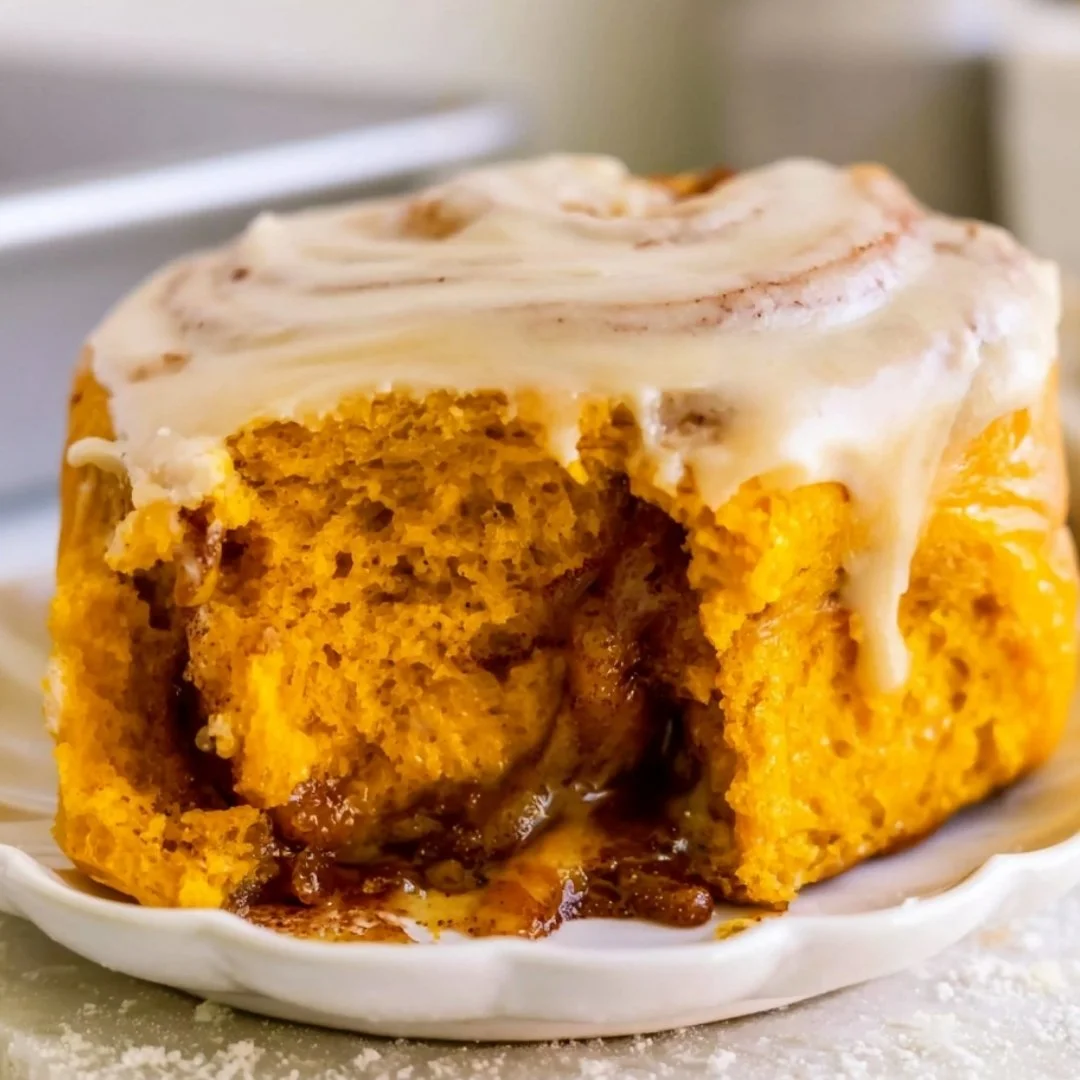 Delicious pumpkin cinnamon rolls topped with cream cheese icing